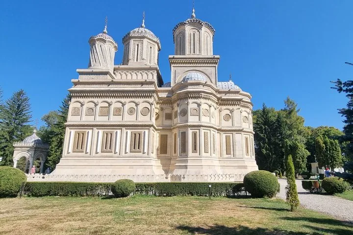 Curtea de Arges Monastery featuring intricate architectural details and multiple domes.